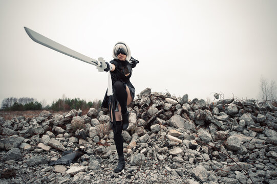 cosplay woman lunges with a sword