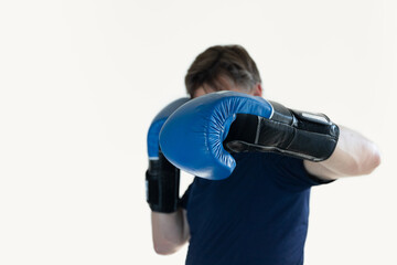 a man with blue Boxing gloves lands a left hook