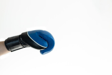 hand in a blue Boxing glove on a white background