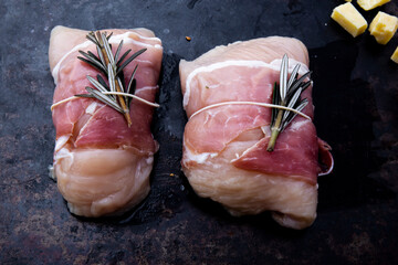 succulent chicken breasts filled with creamy parmigiana stuffing and wrapped in prosciutto