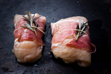 succulent chicken breasts filled with creamy parmigiana stuffing and wrapped in prosciutto
