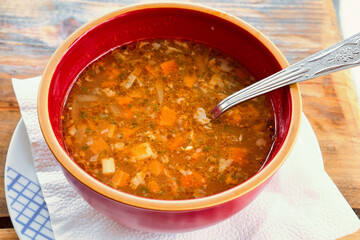 Traditional Serbian fish soup with delicious mountain trout from mount Rtanj and fresh vegetables from farm garden