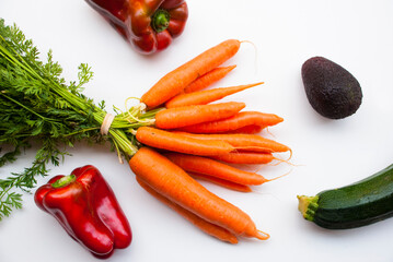Vegetables background isilated. Carrot, papper, avocado on white table.