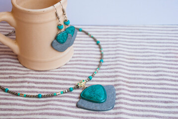 Boho chic style jewelry set in silver and turquoise. Handmade necklace and earrings.