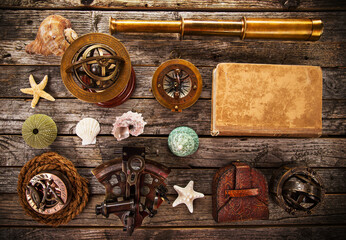 Top view of accessories for travel on vintage wooden background with lots of copy space. Preparing for an adventure trip or sightseeing.