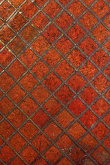 Mother of pearl lacquered wooden surface of an old chest. Colorful  geometric square patterns on...