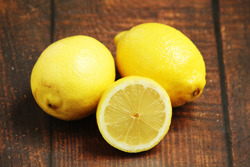 Lemons lying on the wooden rustic table