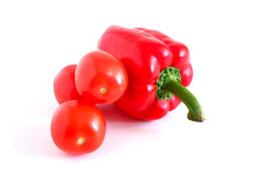 Red sweet peppers and tomatoes on a white background. Suitable for mockups and backgrounds. Food...