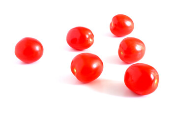 Red tomatoes on a white background. Suitable for mockups and backgrounds. Cooking. Vegetables.