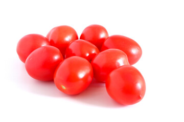 Red tomatoes on a white background. Suitable for mockups and backgrounds. Cooking. Vegetables.