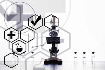 Research laboratory. Test tubes and microscope on the table. Double exposure.