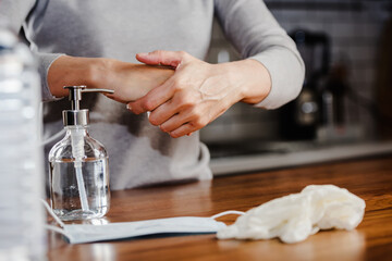 Closeup of woman hands using hand sanitizer liquid for bacteria and virus neutralization. Keep your hands germ-free and virus free with the use of hand sanitizer. Personal Protective Equipment for Inf