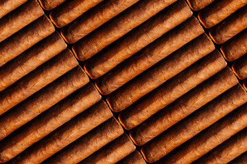 The diagonal layout of Cuban cigars is a view from above. Beautiful background smoking pattern