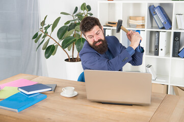 hate my job. dealing with error. overworked man crush laptop with hammer. frustrated computer user. businessman express anger. ready to smash. Office life makes him crazy. Slow internet connection