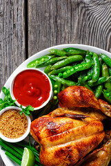 rotisserie chicken with fried pods of peas