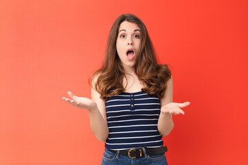 young pretty woman feeling extremely shocked and surprised, anxious and panicking, with a stressed...