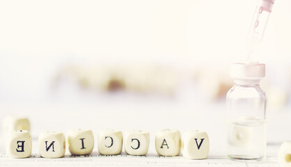 A man signs a medical document. Medical equipment on the table. Stethoscope and ampoules with syringes. Makes notes in the office. Medical center.