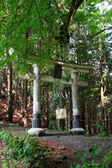 Shinto shrine gate "Torii" of "Mitsumine Jinja Shrine Okumiya" at the top of Myohogatake mountain in Chichibu, Tokyo, Japan. Japanese test on the gate is "Okumiya"(Rear shrine).
