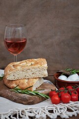 Sliced focaccia bread with tomatoes and mozzarella