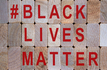 Wooden blocks form the words 'blacklivesmatter'. Beautiful wooden background. Concept image.