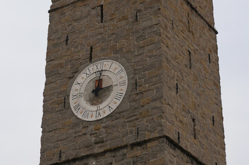Fototapeta na wymiar Clock on the tower of the Cathedral of the Assumption of the Blessed Virgin Mary (Stolna cerkev Marijinega vnebovzetja). Koper, Slovenia.