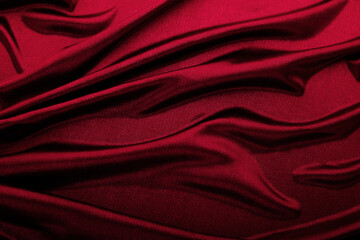 Texture of red fabric in waves.