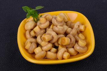Pickled champignon heap in the bowl