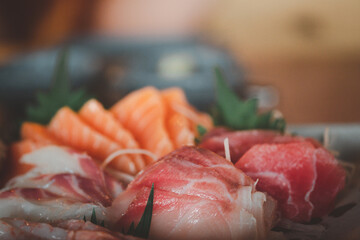 Mixed slices of fresh raw salmon sashimi for dinner.