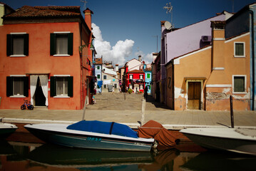 Fototapeta na wymiar Canal through the Murano village in the Venice lagoon in Italy. 