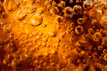 abstract water with  bubbles soars over a golden background