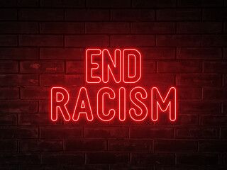 End racism - red neon light word on brick wall background