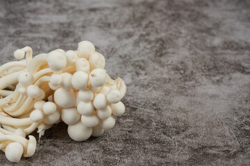 White and brown shimeji mushrooms on the market.