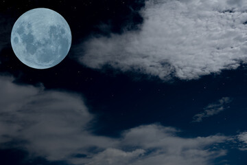 Fototapeta na wymiar Full moon with blurred white clouds at night.