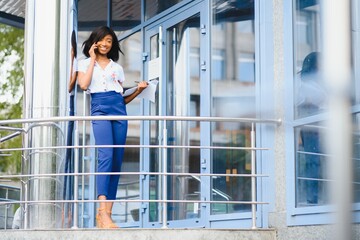 A shot of a beautiful black businesswoman outdoor