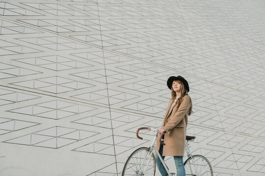 Young hipster woman on a bicycle