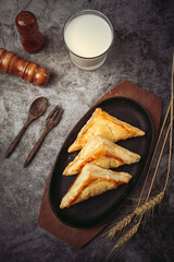 Chicken pie or kurnik that is beautifully decorated on the table. © artit