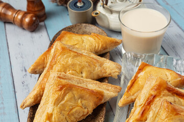 Chicken pie or kurnik that is beautifully decorated on the table. © artit
