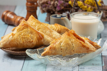 Chicken pie or kurnik that is beautifully decorated on the table. © artit