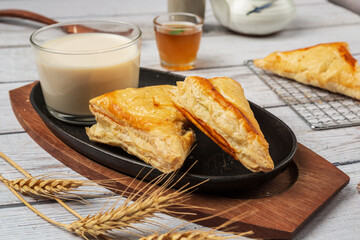 Chicken pie or kurnik that is beautifully decorated on the table. © artit