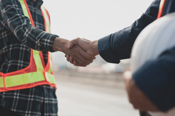 Teamwork Engineer shake hand agreement deal project construction success,Technician support partner...