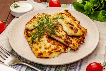 Hot appetizer - pita bread with cheese and herbs. Vegetarian healthy food