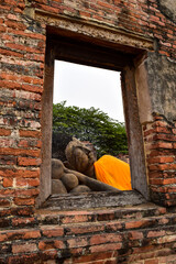 Wat Thai in Ayutthaya.Historic City of Ayutthaya.Buddha is view from the window in the ancient temple.