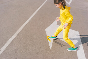 Girl stepping on banana peel on a street