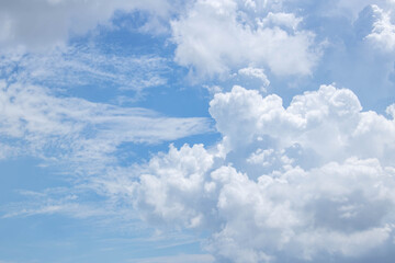 Bright blue sky with fluffy white clouds. Clearing day and Good weather. Blue sky background.