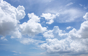 Bright blue sky with fluffy white clouds. Clearing day and Good weather. Blue sky background.