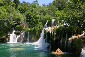 Fototapeta na wymiar Beautiful waterfalls in National Park Krka, Croatia on a sunny summer day. 