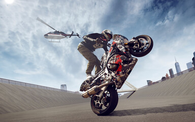 Moto rider making a stunt on his motorbike. Biker doing a difficult and dangerous stunt.