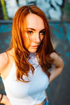 Portrait of serious redheaded woman