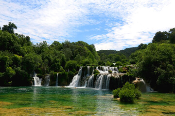 Beautiful waterfalls in National Park Krka, Croatia on a sunny summer day. 
