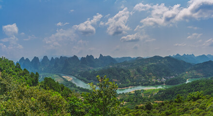 Xianggong Hill viewpoint panorama of beautiful green, lush and dense karst mountain landscape in Yangshuo, Guangxi Province, China